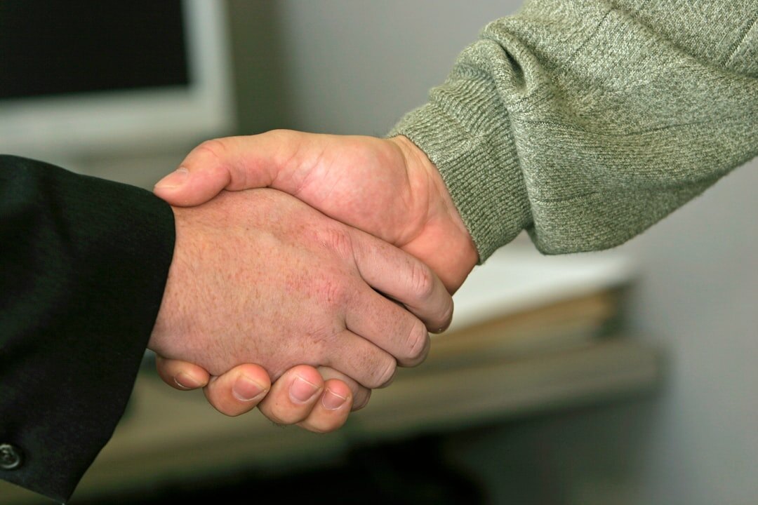 Close up of a business handshake between two partners