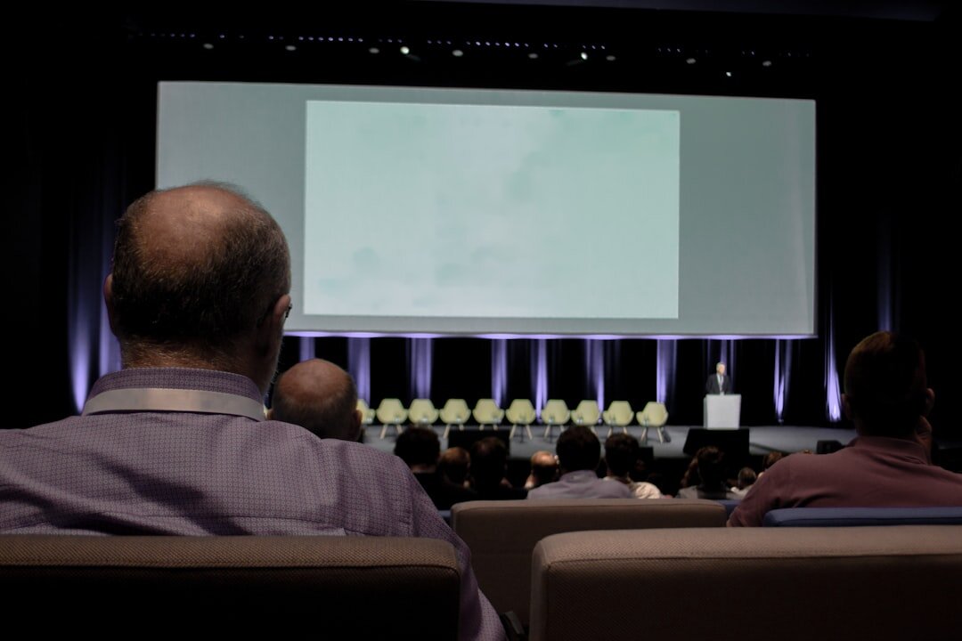 Business conference room filled with seated attendees