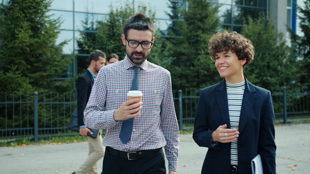 Group of business professionals walking outside an office building